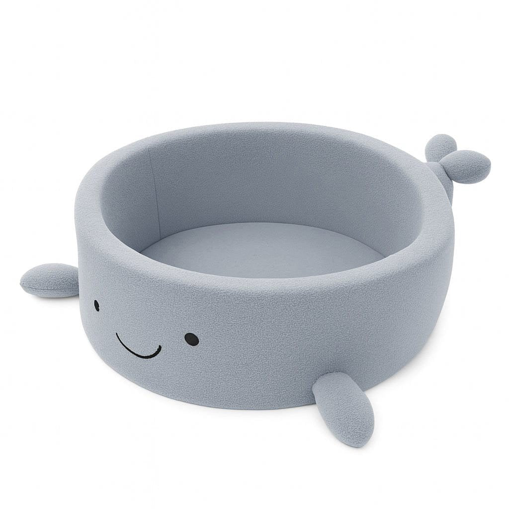 1. Whale-shaped baby ball pit in dusty ice blue boucle fabric with soft fins and smiling face, designed for sensory play and motor development
