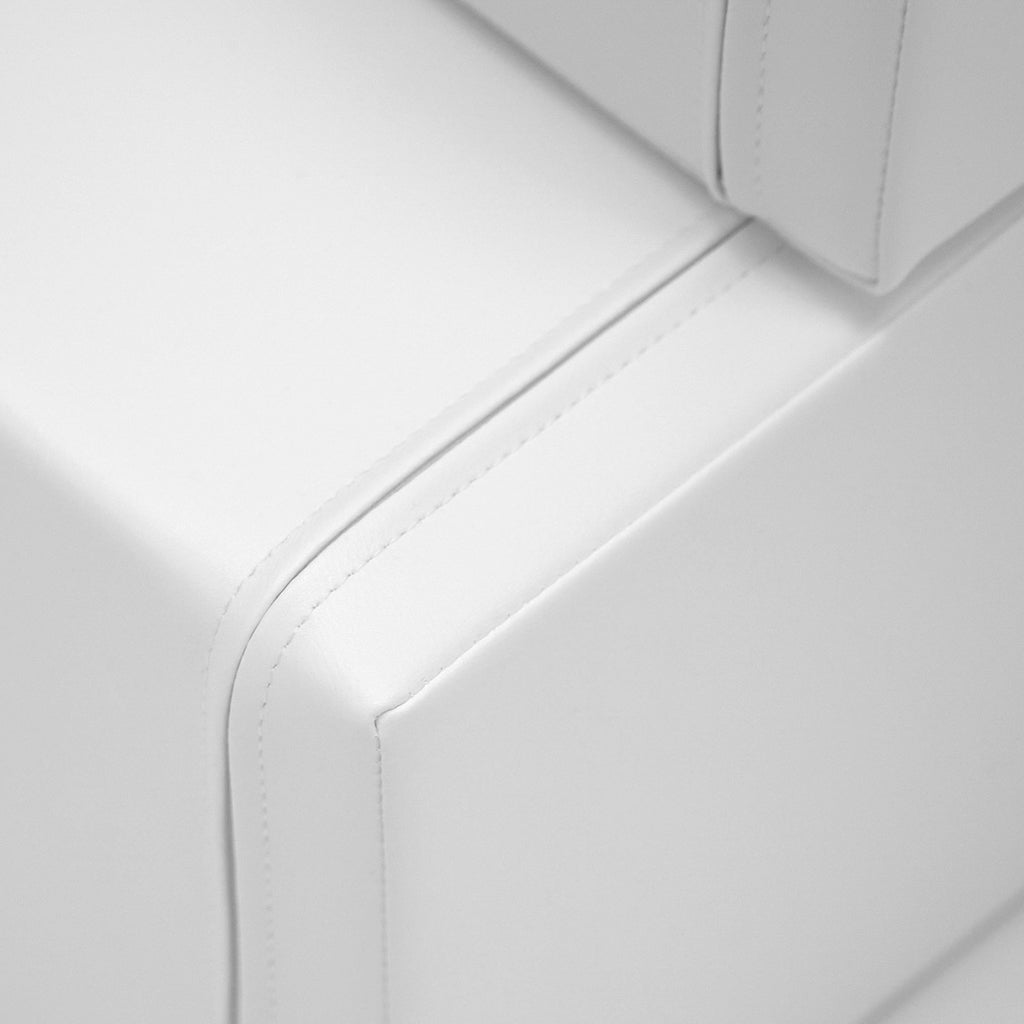 6. Close-up of white foam building block showing stitching detail on soft eco-leather cover