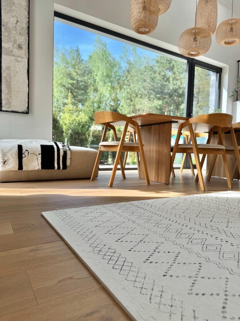 3. Close-up of ivory and black boho playmat in modern dining room with natural light