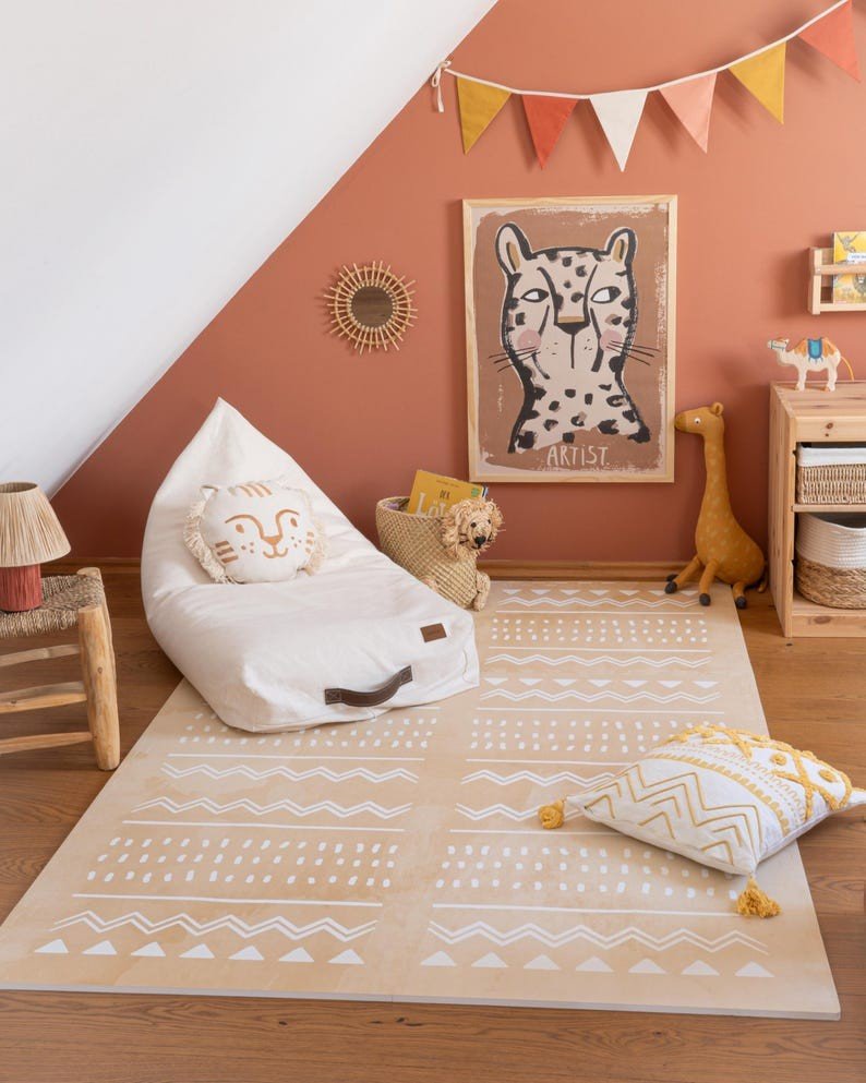 1. Cozy playroom with OLYA KIDS Boho sand puzzle playmat, bean bag, and decorative pillows in a warm, minimalist setting