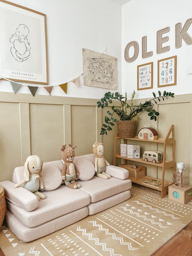 1. Stylish playroom with OLYA KIDS Boho sand puzzle playmat, plush toys, and wooden shelves