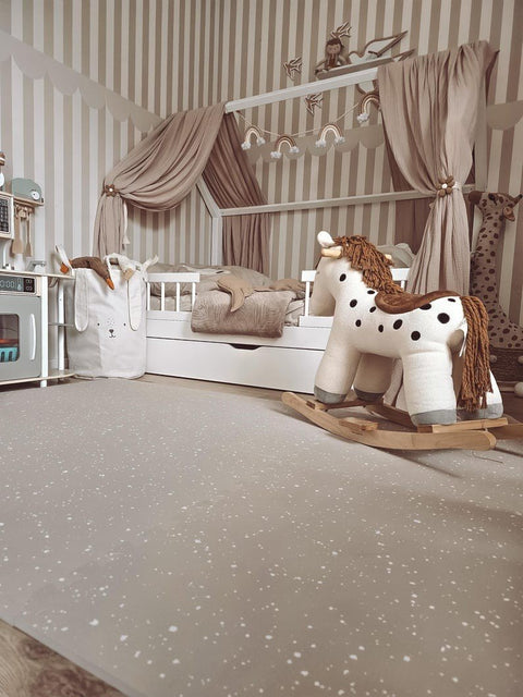 3. Cozy nursery with cappuccino foam puzzle playmat, rocking horse, and striped walls