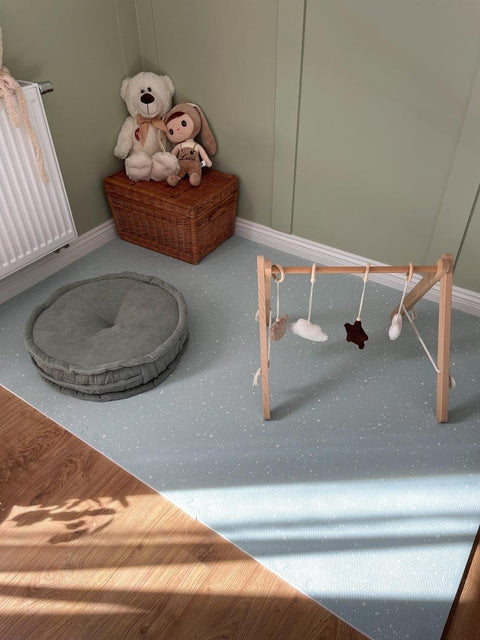 5. Olive foam puzzle playmat in nursery with wooden toy gym and plush toys