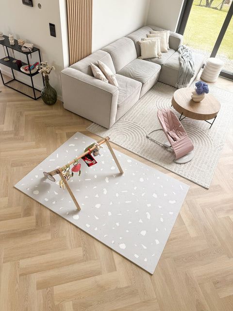 5. Living room with lavender terrazzo playmat and wooden play gym