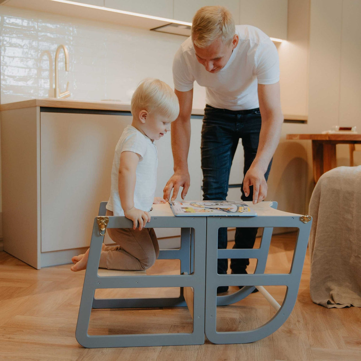 5. Child and adult using grey kitchen tower in table mode for activities