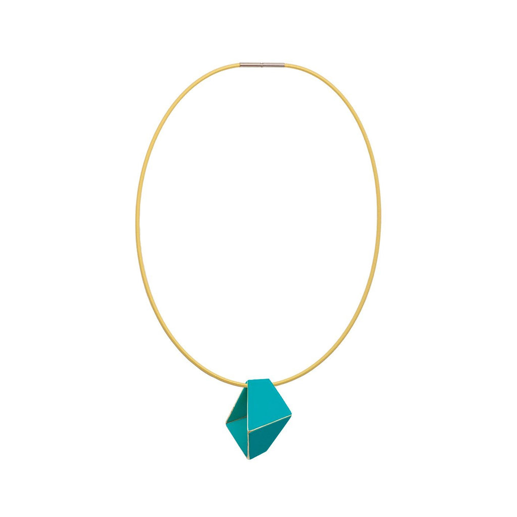6. Studio image of Lisa Kroeber Jewellery Folded Necklace in turquoise, showcasing geometric pendant on brass chain
