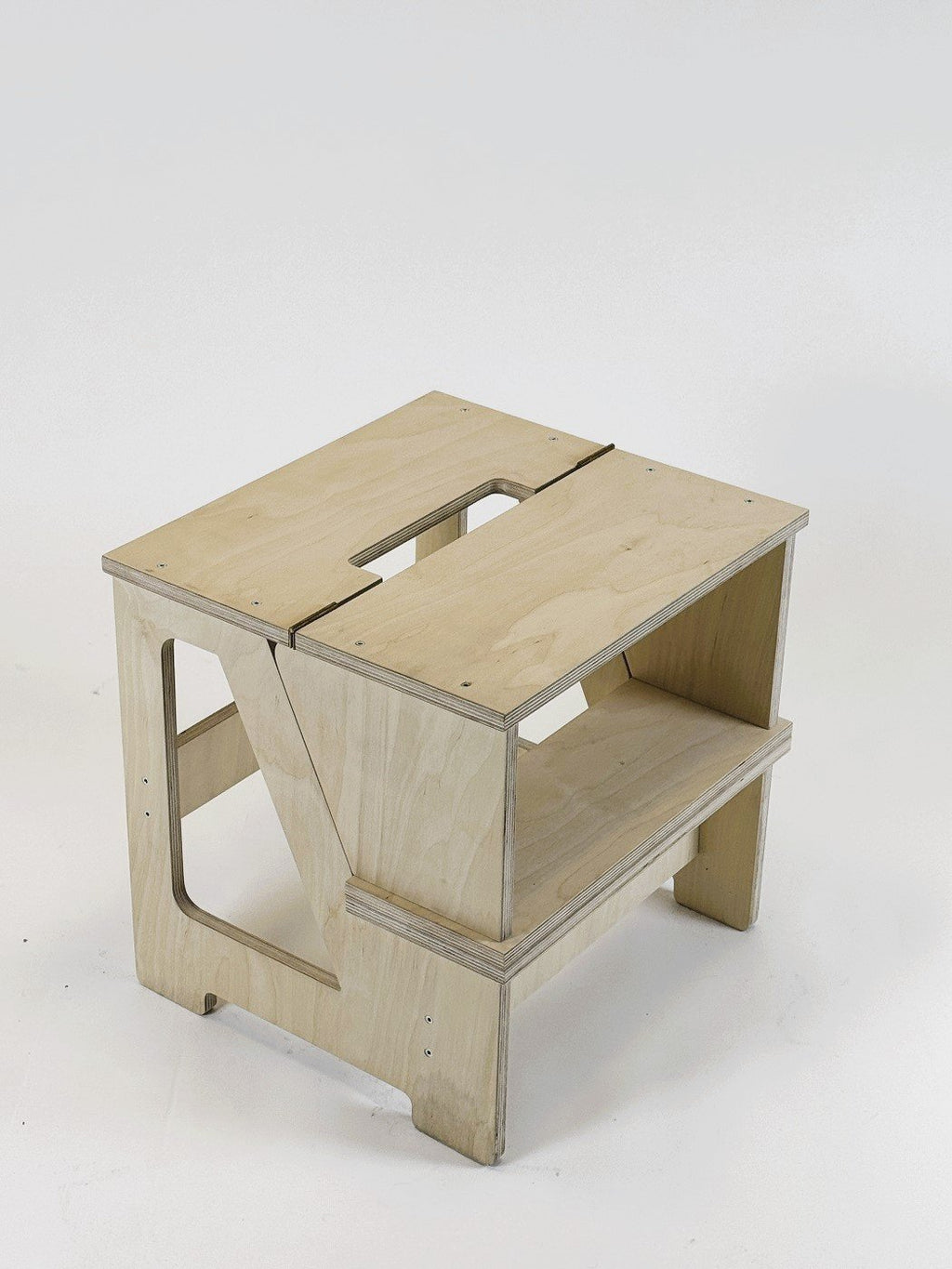 2. Wooden folding seat and climbing helper in studio setting with compact folded form
