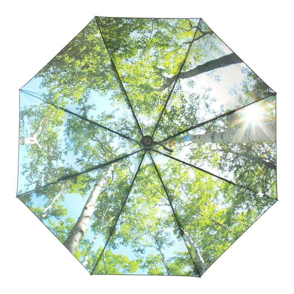 3. Top view of open forest print umbrella showing detailed rainforest pattern