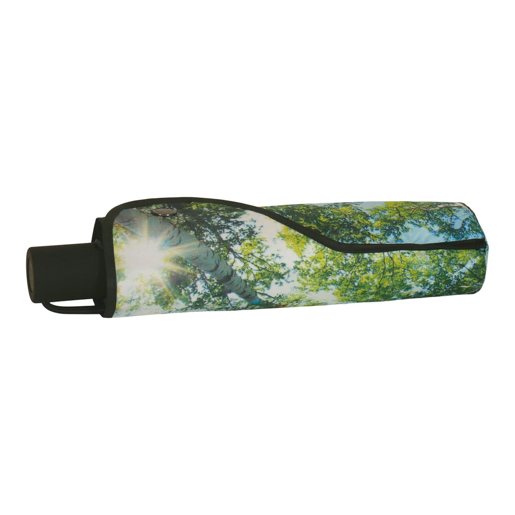 4. Closed forest print umbrella with black handle and rainforest design