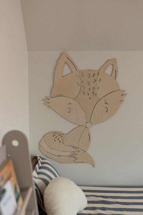 3. Fox wooden wall decoration on white wall above bed with striped bedding