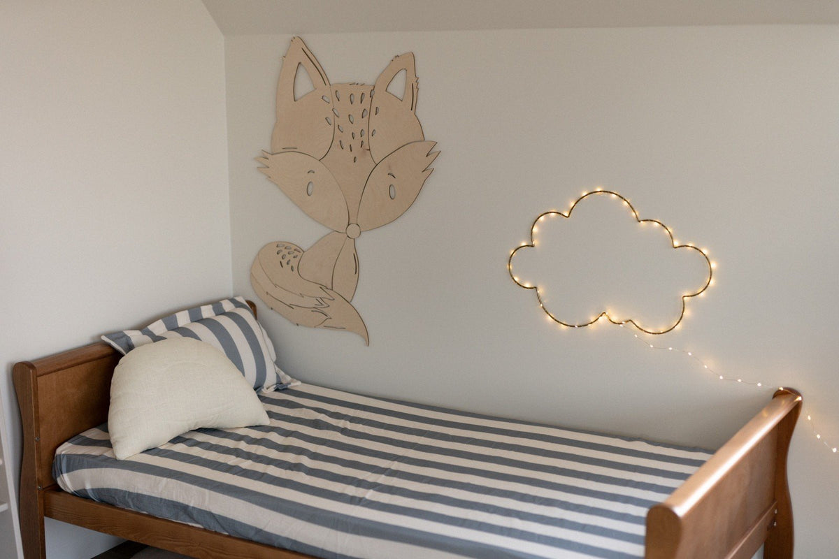 5. Fox wooden wall decoration with cloud light above bed in children's room