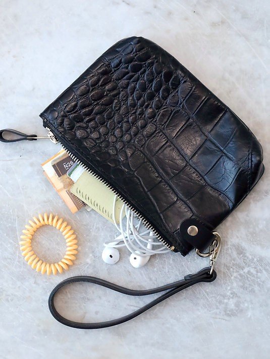 10. Black alligator leather POUCH wallet open with cash, earphones, and accessories visible
