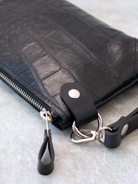 6. Close-up of black alligator leather POUCH wallet showing zipper and wrist strap details