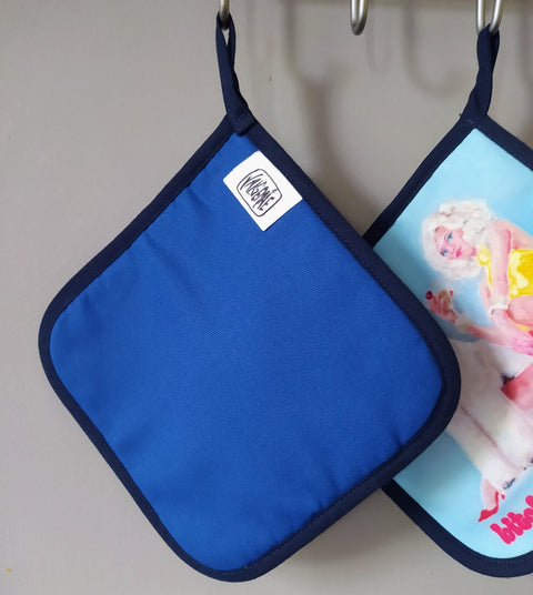 2. Blue pot holder with Katrin Valgemäe logo tag, hanging on hook