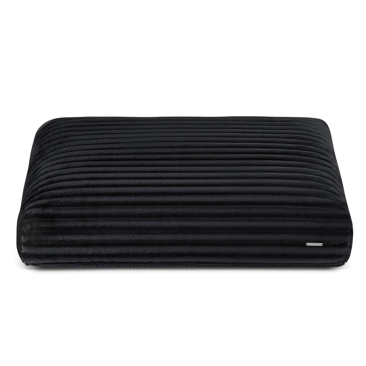 2. Black ribbed dog cushion by Labbvenn in studio setting, showcasing plush texture and sleek design