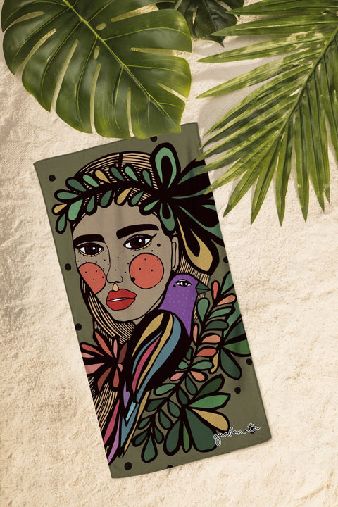1. Khaki Towel Gabija by Garbanota featuring hand-drawn design, shown on sand with tropical leaves