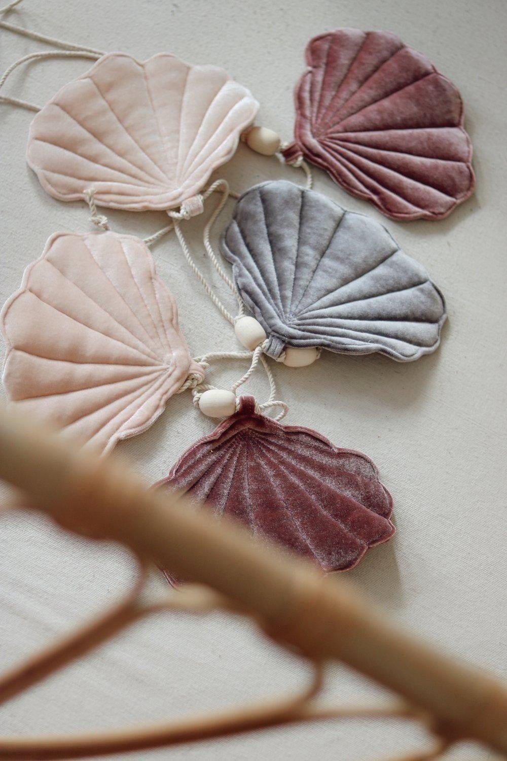 4. Detail of velvet shell garland with marsala, pastel apricot, and grey shells on a cotton string with wooden beads