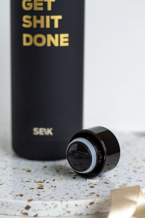 3. Close-up of SEIK black water bottle cap and 'Get Shit Done' text, highlighting vacuum-insulated design
