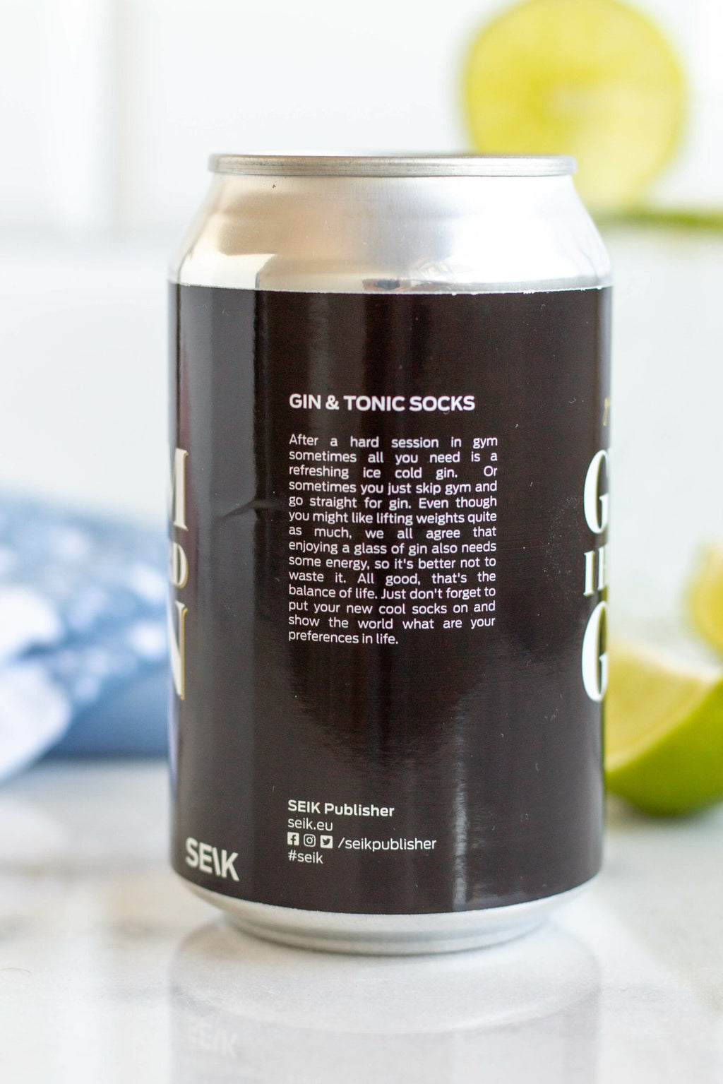 5. Back view of SEIK 'Gym I Heard Gin' can with product description, socks in background