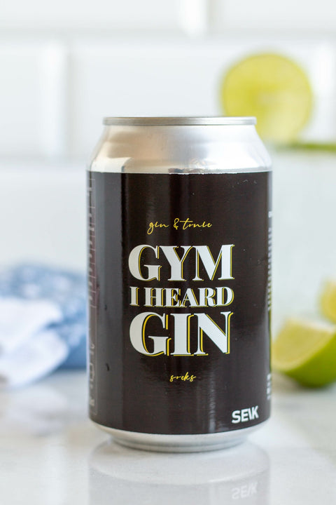 4. SEIK 'Gym I Heard Gin' can with socks, lime, and drink in lifestyle setting
