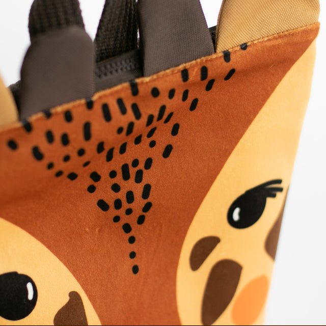 8. Close-up of Muni giraffe backpack, detailing giraffe face design and velvet texture