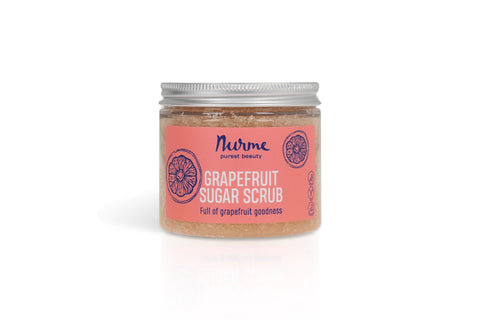 2. Nurme Grapefruit Sugar Scrub jar with pink label and grapefruit illustration, on a white background