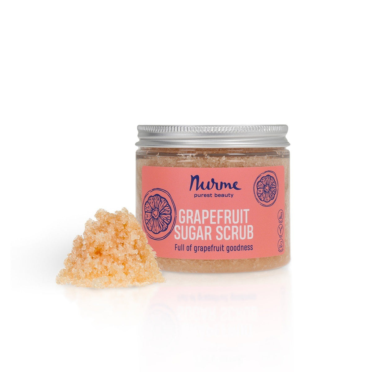 1. Nurme Grapefruit Sugar Scrub jar with pink label and grapefruit illustration, next to a pile of sugar crystals, on a white background