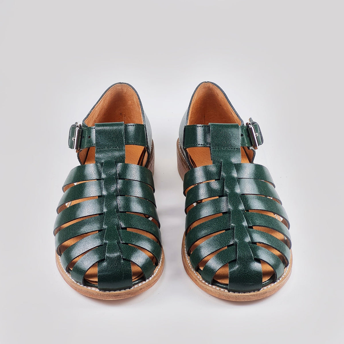 4. Studio image of Daz Studio dark green leather fisherman sandals showing round toe and leather sole