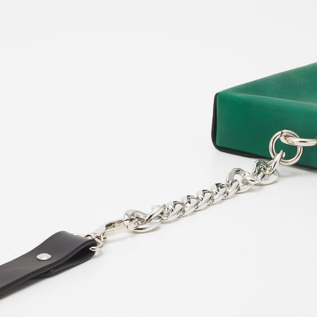 6. Close-up of Daz Studio green leather envelope bag showing silver chain and black strap