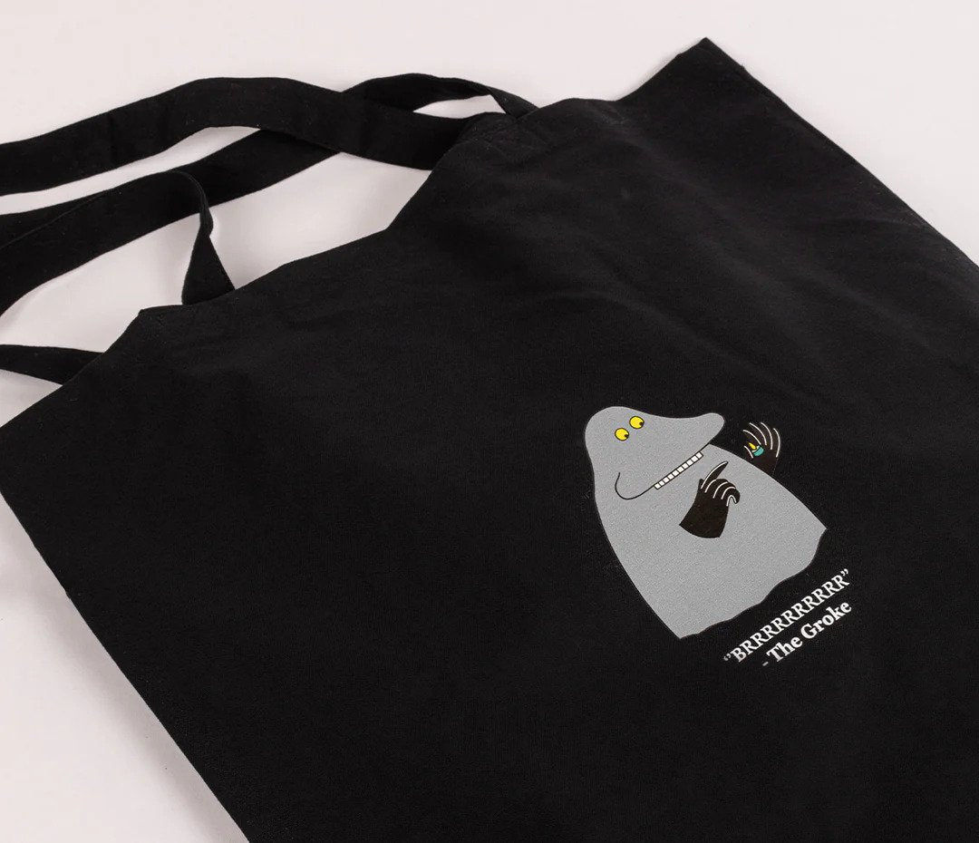 3. Close-up of The Groke design on black Moomin tote bag, emphasizing heavy cotton fabric