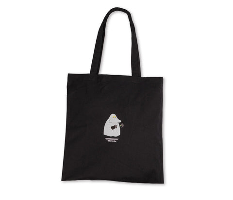 4. Flat lay of black Moomin The Groke tote bag, showing front design and sturdy handles