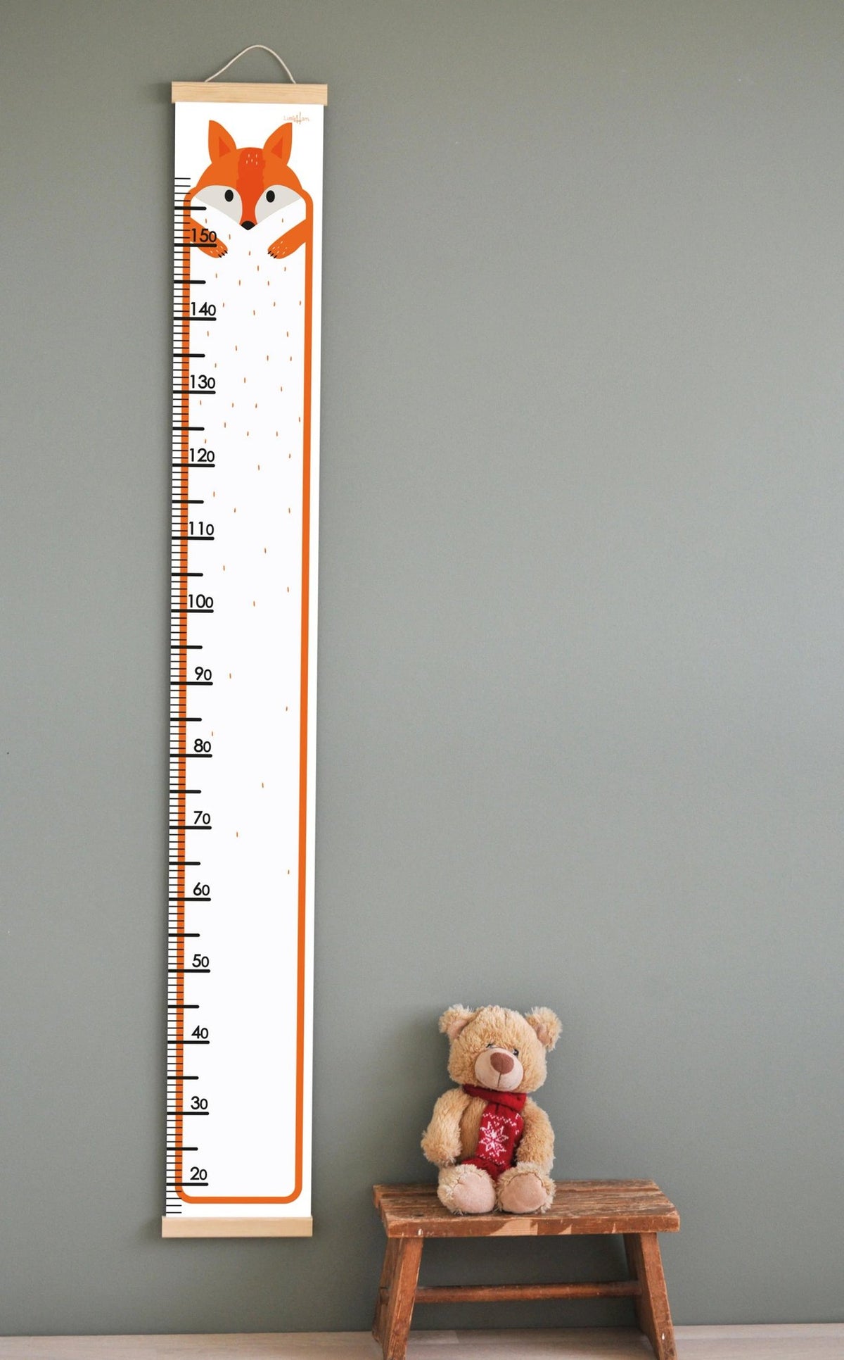 1. Kids' growth chart featuring a cute fox illustration with measurement scale up to 165 cm, printed on durable PVC fabric with wooden slats, hanging on a wall above a teddy bear on a stool.