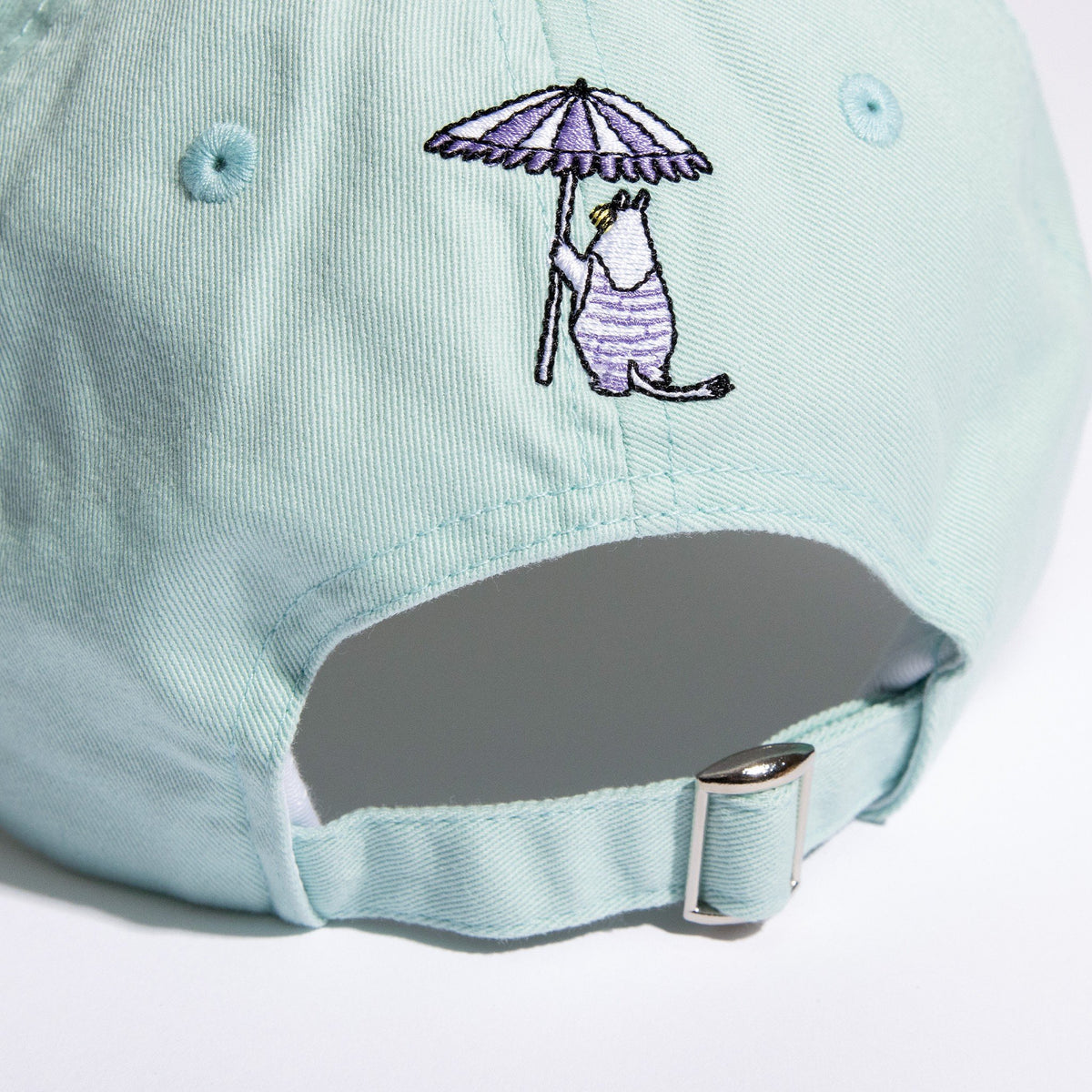 3. Close-up of adjustable strap and back embroidery on mint Snorkmaiden Dad Cap