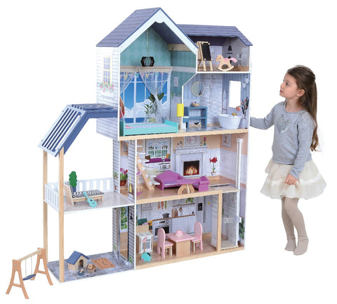 1. Young girl playing with Gerardo's Toys wooden dollhouse Crystal, featuring four floors, LED lights, and various furniture in a cozy room setting