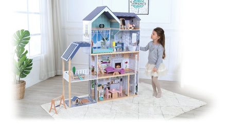 1. Young girl interacting with Gerardo's Toys wooden dollhouse Crystal, showcasing four floors, LED lights, and detailed interior in a living room