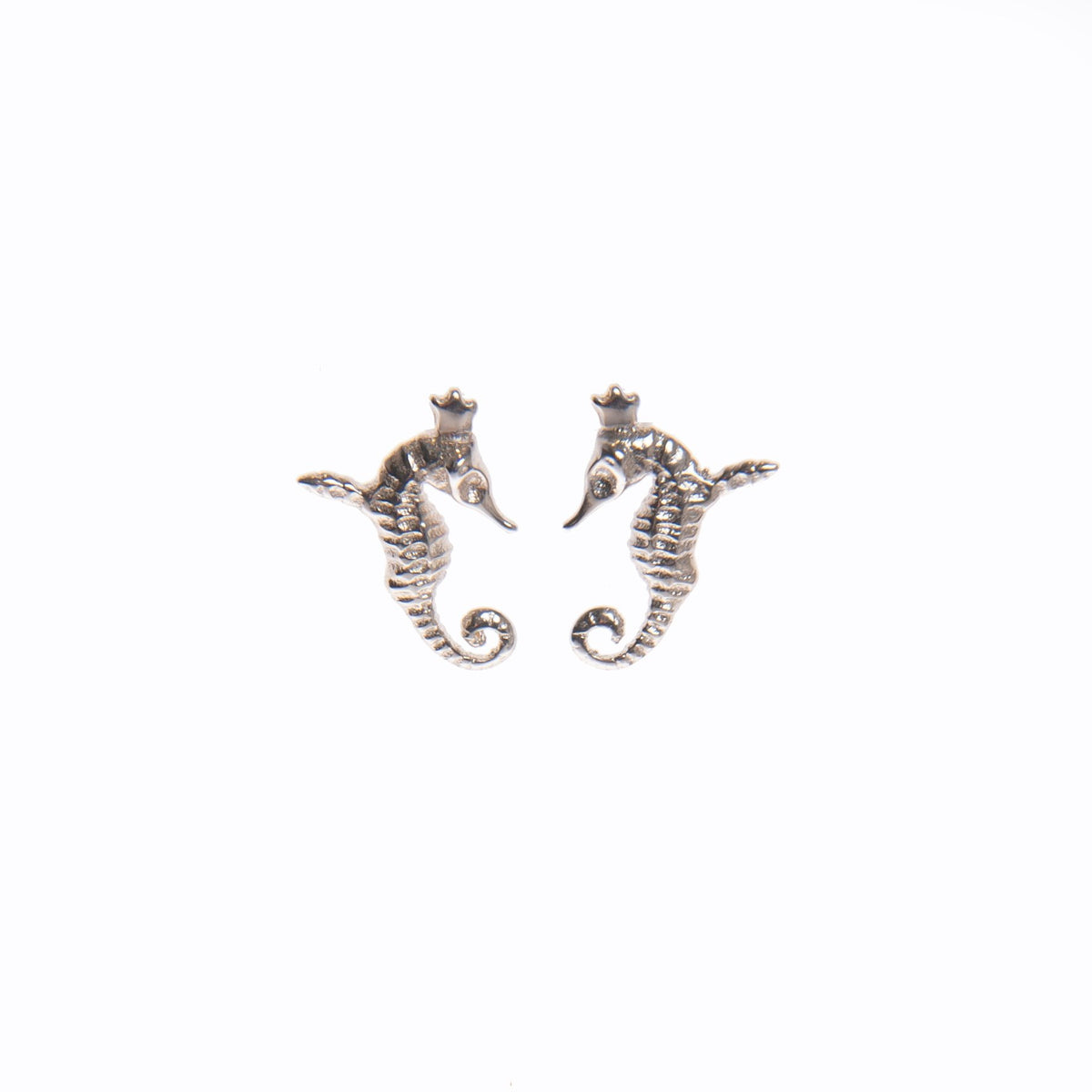 2. Pair of Tanel Veenre Mini Hippocamp silver earrings shaped like crowned winged seahorses on white background