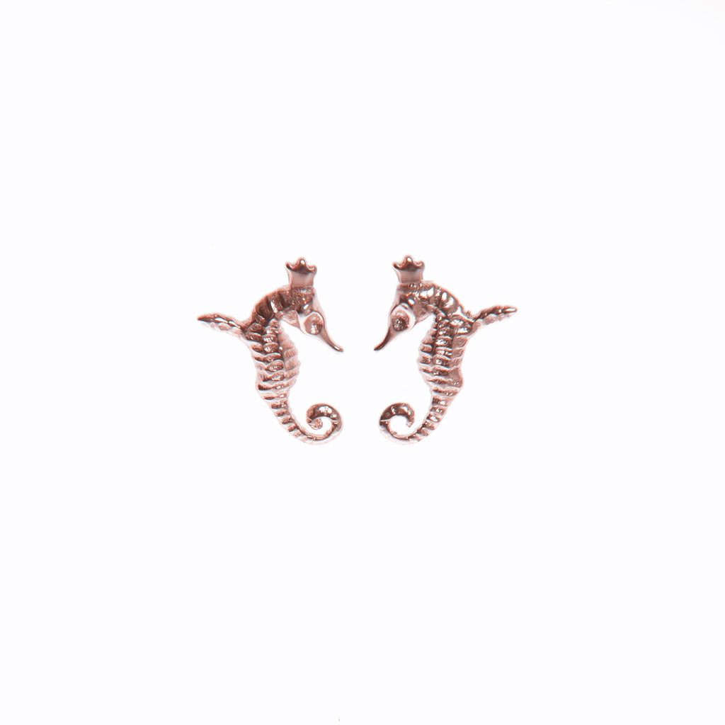 2. Pair of Tanel Veenre Mini Hippocamp rose gold earrings shaped like crowned winged seahorses on white background