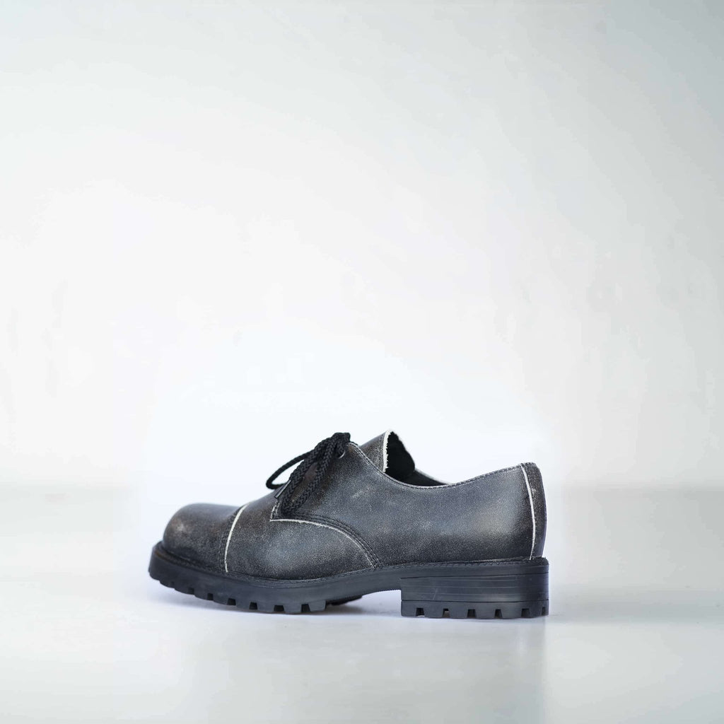 2. Side view of Samelin's Antique Widgets unisex sneaker, highlighting military-grade quality and leather material