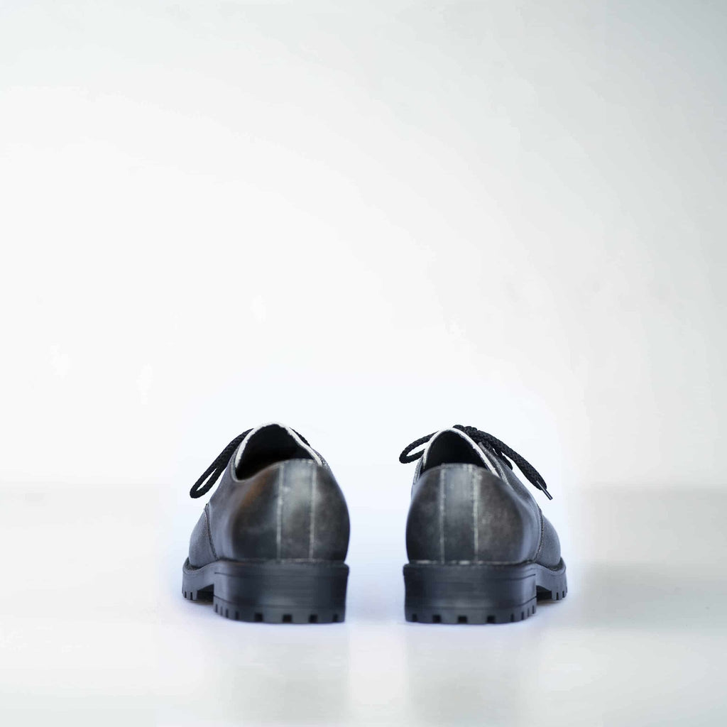 3. Back view of Samelin's Antique Widgets unisex sneaker, showing durable construction and PU outsole