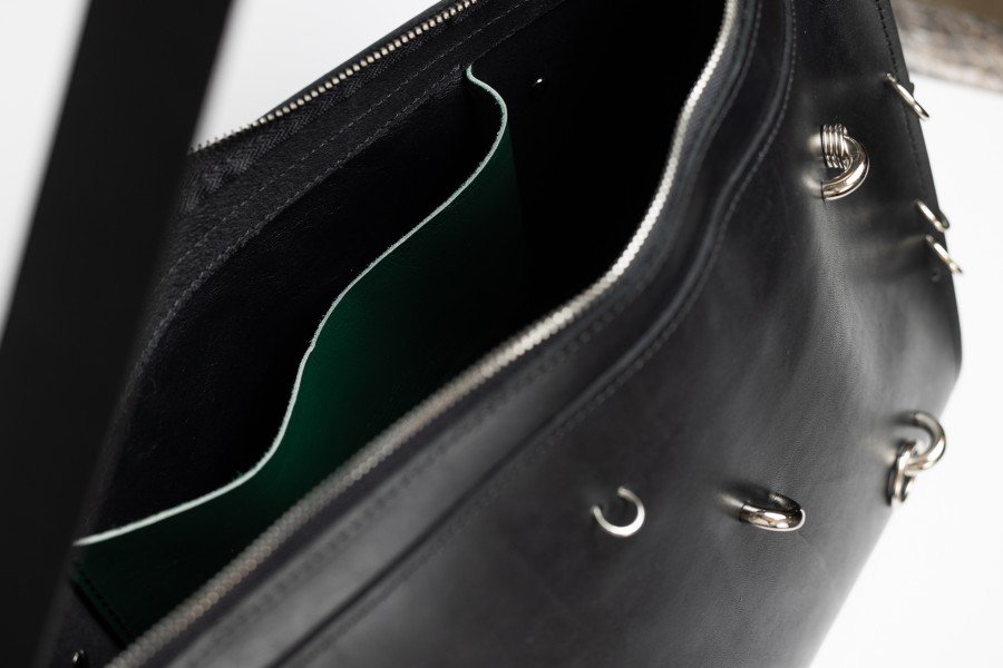 3. Interior view of ARINA handbag showing spacious compartment and silver zipper