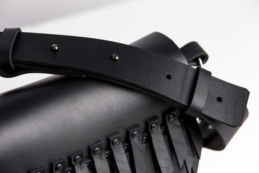 3. Close-up of PYKOK BARBED SISTER handbag showing black leather strap and fringe detail