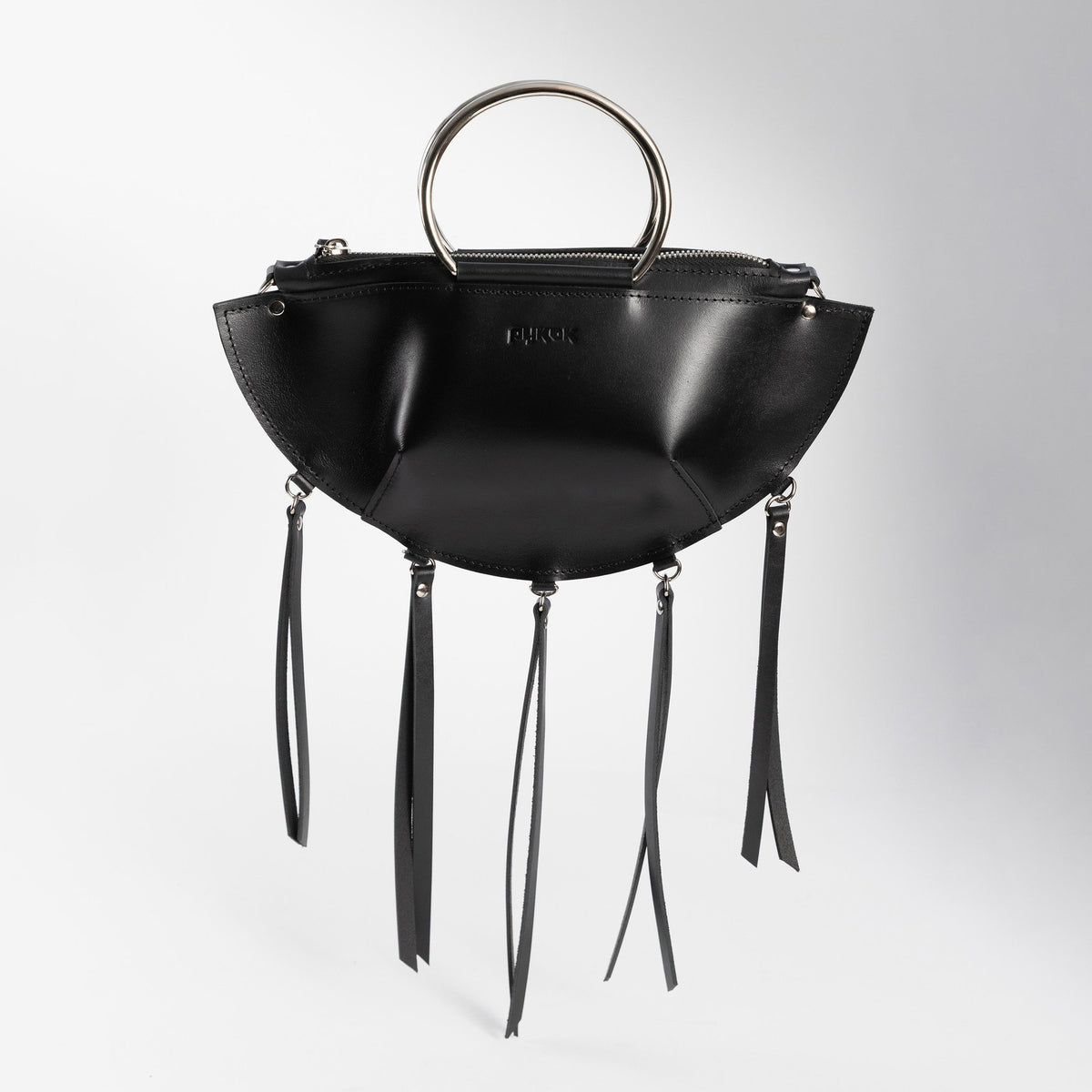 13. Black leather KAYA handbag with metal ring handles and tassels, shown upright against a white background