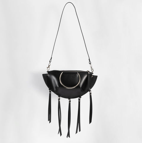 1. Black leather KAYA handbag with metal ring details and tassels, shown with a shoulder strap against a white background