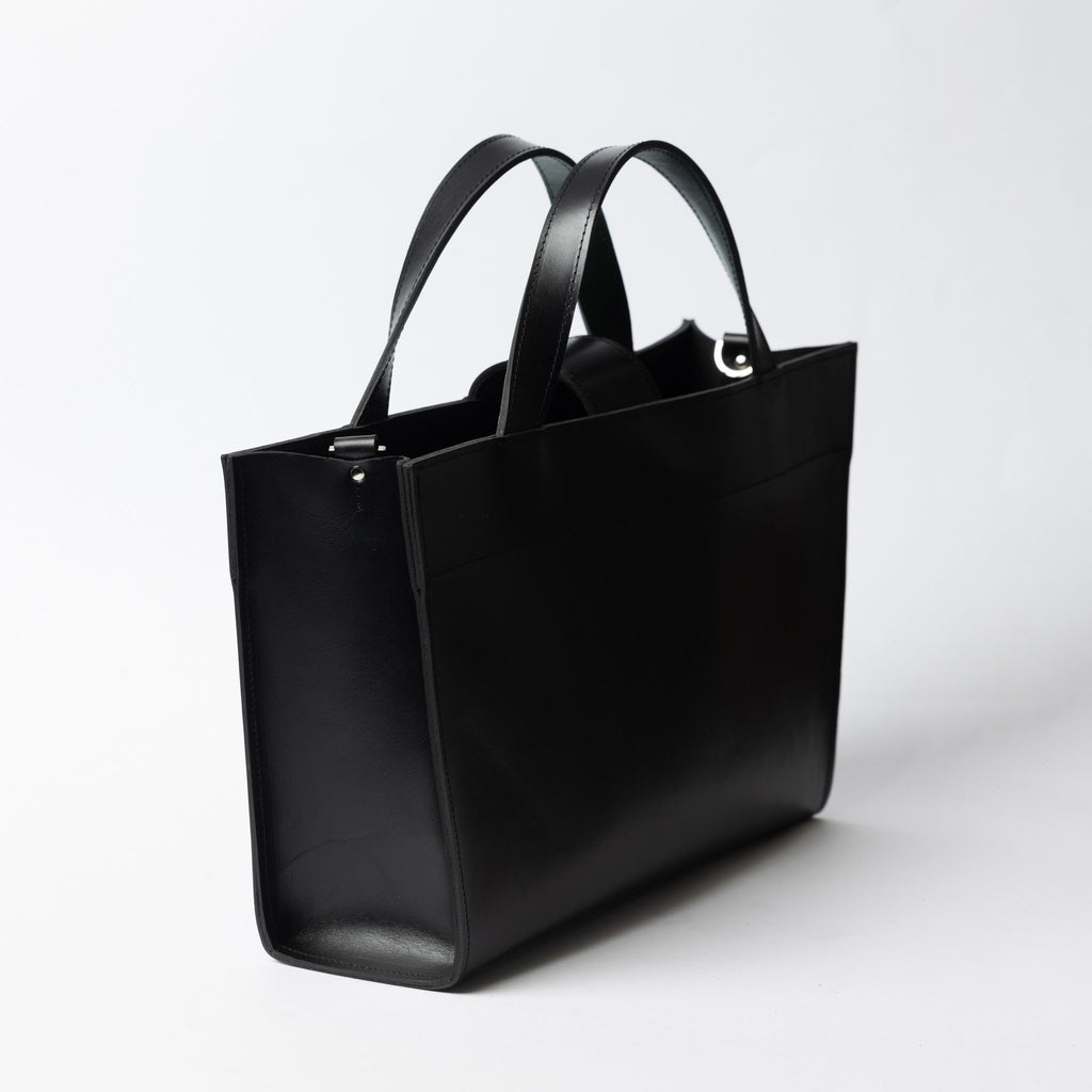 5. Side view of black leather MONIKA tote bag with dual handles