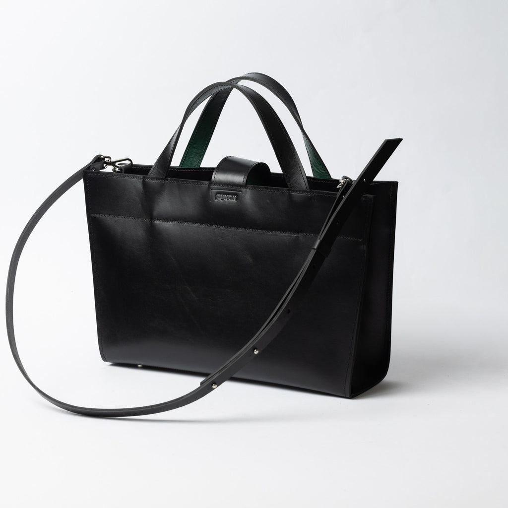 3. Black leather MONIKA tote bag with adjustable strap shown from side