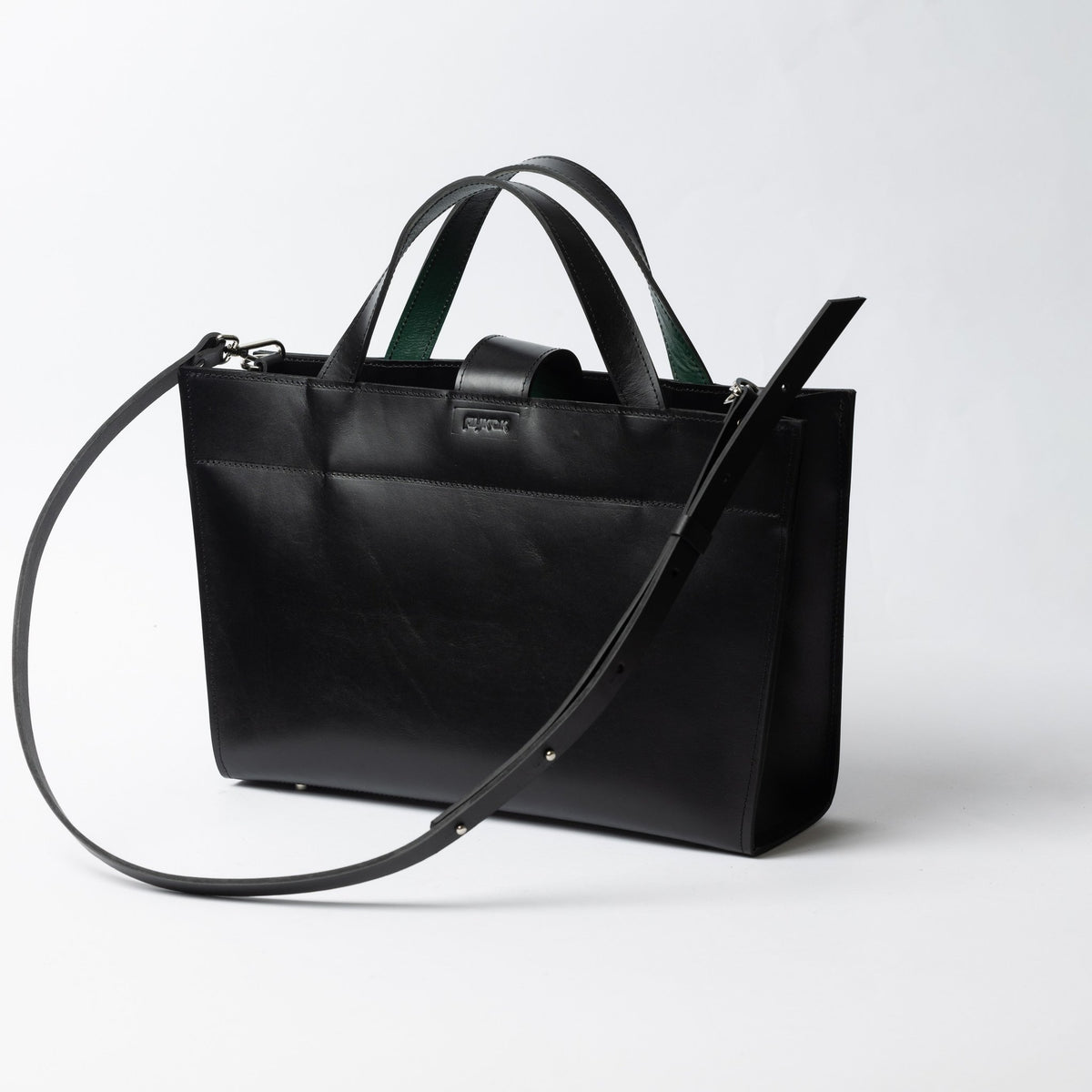 3. Black leather MONIKA tote bag with adjustable strap shown from side