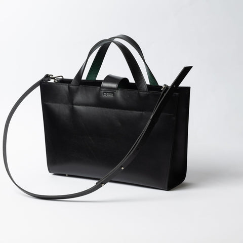 3. Black leather MONIKA tote bag with adjustable strap shown from side
