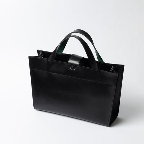 4. Black leather MONIKA tote bag with dual handles on white background