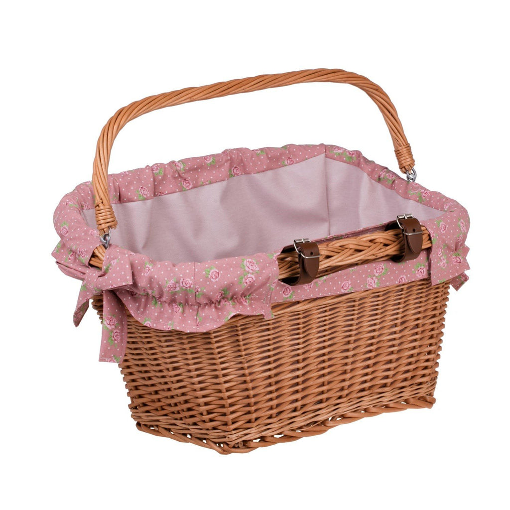 4. Handmade wicker bike basket with pink floral fabric liner and leather straps, shown from an angle, highlighting easy attachment