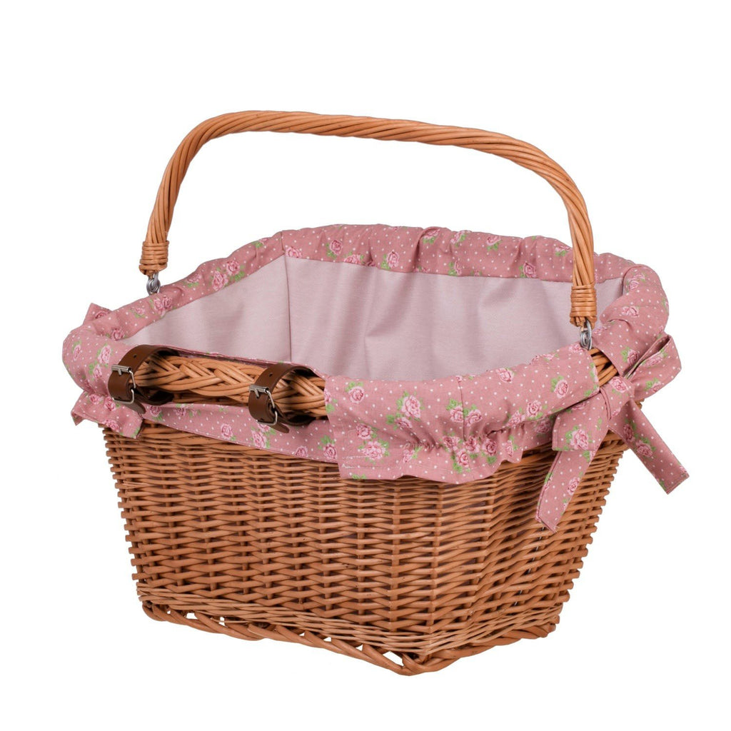 9. Front view of handmade wicker bike basket with pink floral fabric liner and handle, emphasizing spaciousness and style